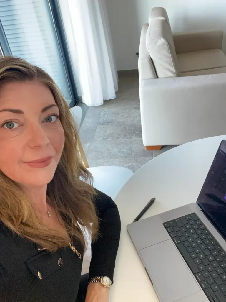 Consultant working at a laptop in a bright office