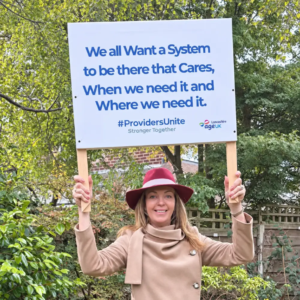 Victoria Buyer holding a Providers Unite campaign placard at the Labour Party Conference in Liverpool in 2025.